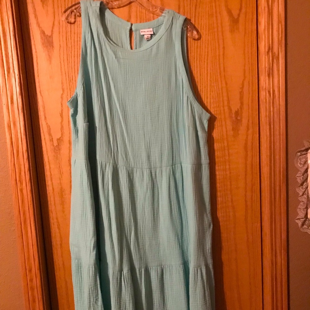 Tiered cotton maxi dress that is mint green. Lightweight dress for summer.